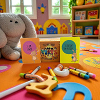 Children's play area with educational cards, crayons, and a stuffed elephant toy on an orange mat.